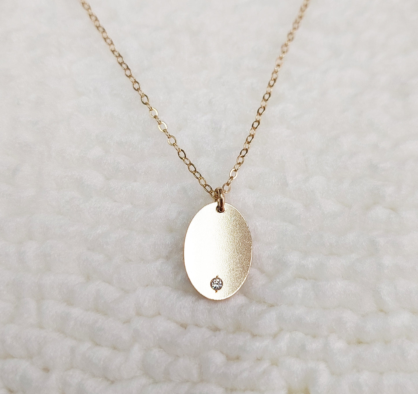 GF1309OVCZ Gold Filled (14KGF) 13 x 9.0mm Oval Tag 20ga (1.1mm hole) with CZ