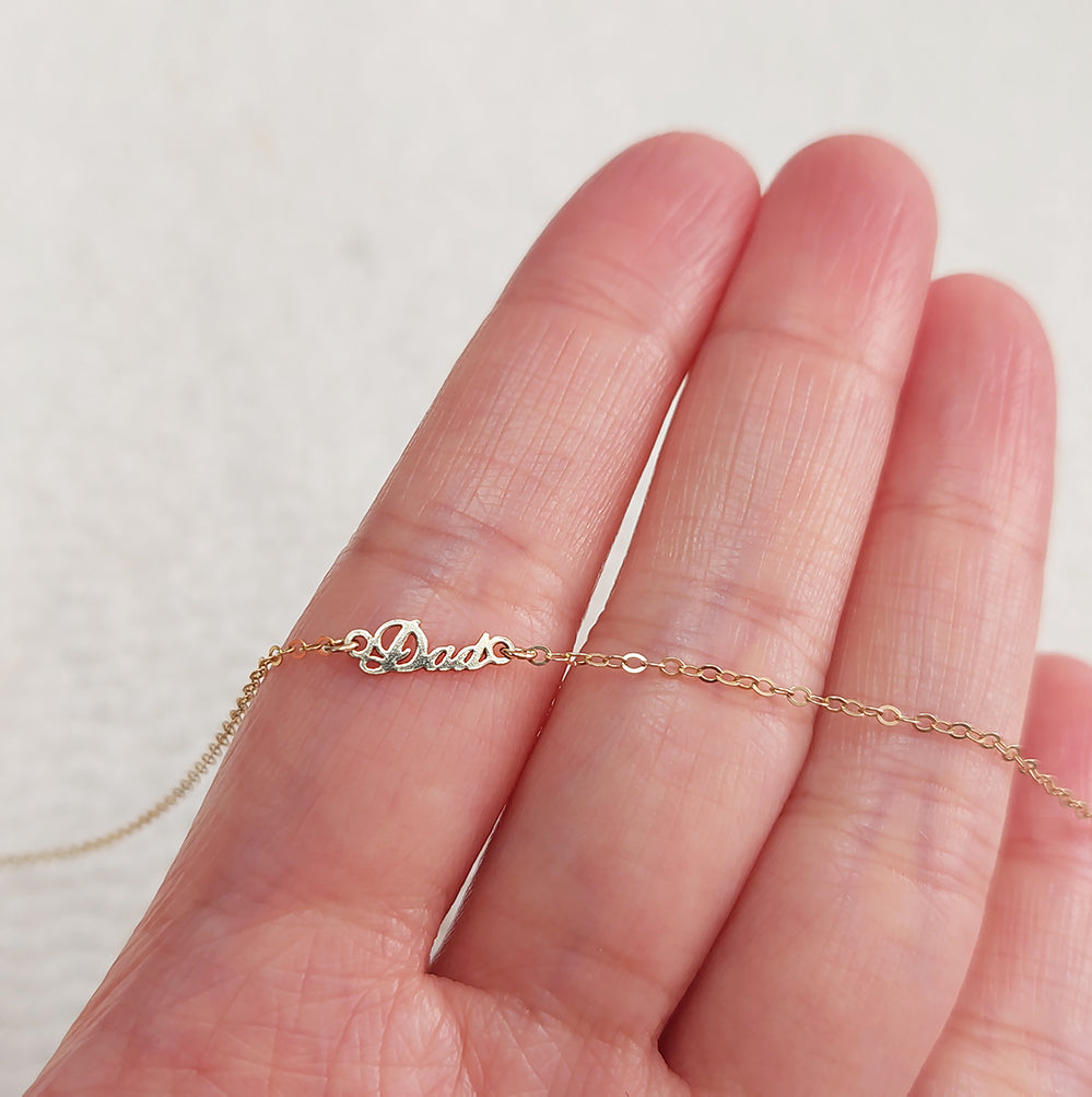 DA1036 Tiny Size Word "Dad" Connector 24ga